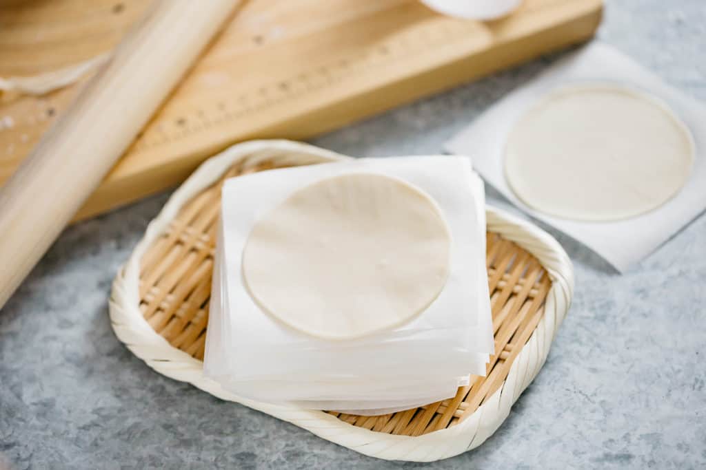 Japanese homemade Gyoza Wrappers stak on a bamboo tray