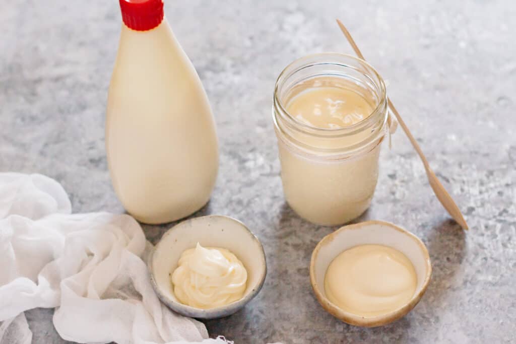 Kewpie mayonnaise bottle and homemade Japanese mayo in a glass jar 