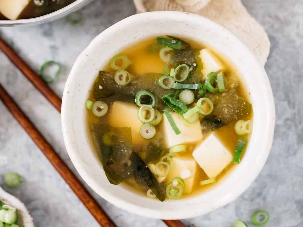 tofu and seaweed miso soup served in a small serving bowl