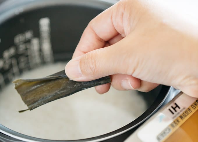 cooking rice in a rice cooker with a strip of Konbu kelp