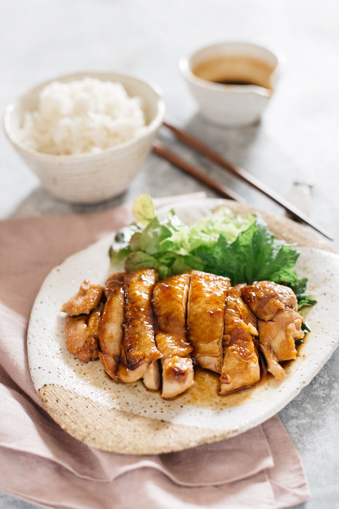 Teriyaki Chicken served on an oval plate with a bowl of plain rice