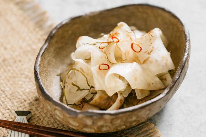 pickled daikon served in an oval small bowl