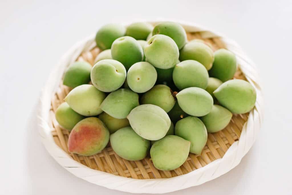 Ume plum fruits on a round bamboo tray