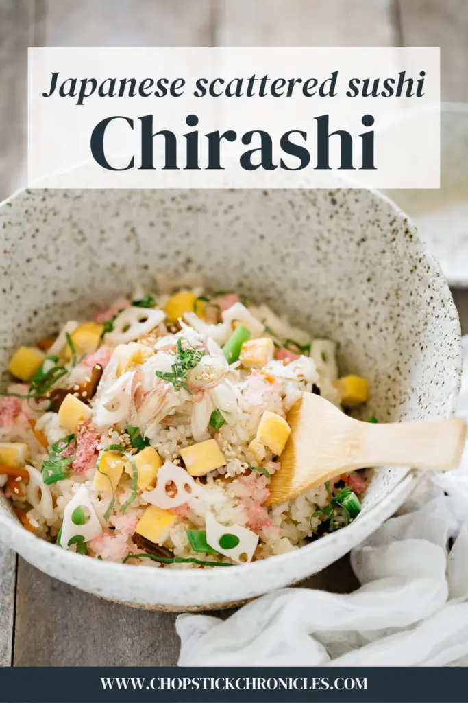 chirashi is served in a large ceramic bowl with a wooden spoon with text overlay for pinterest