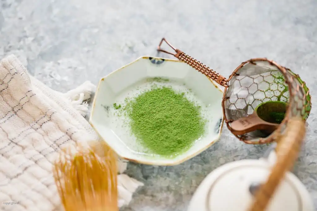 matcha powder shifted on to a small plate