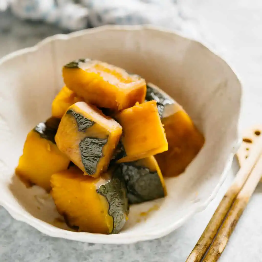 simmered kabocha served in a Japanese pottery serving bowl