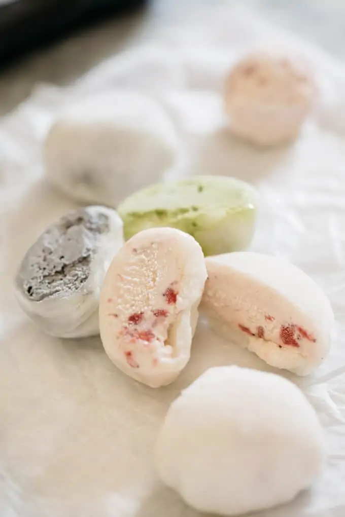 three different flavoured mochi ice cream on a table