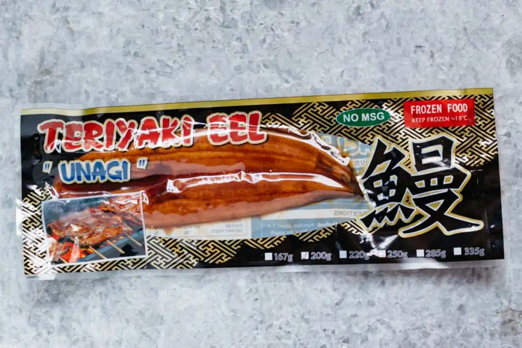 commercially packaged eel kabayaki on a kitchen bench